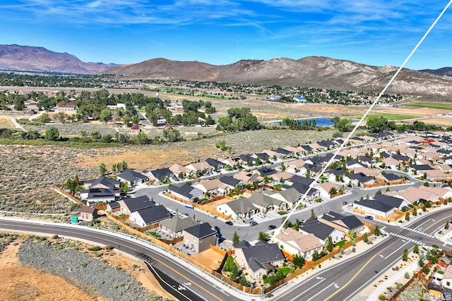 birds eye view of property with a mountain view