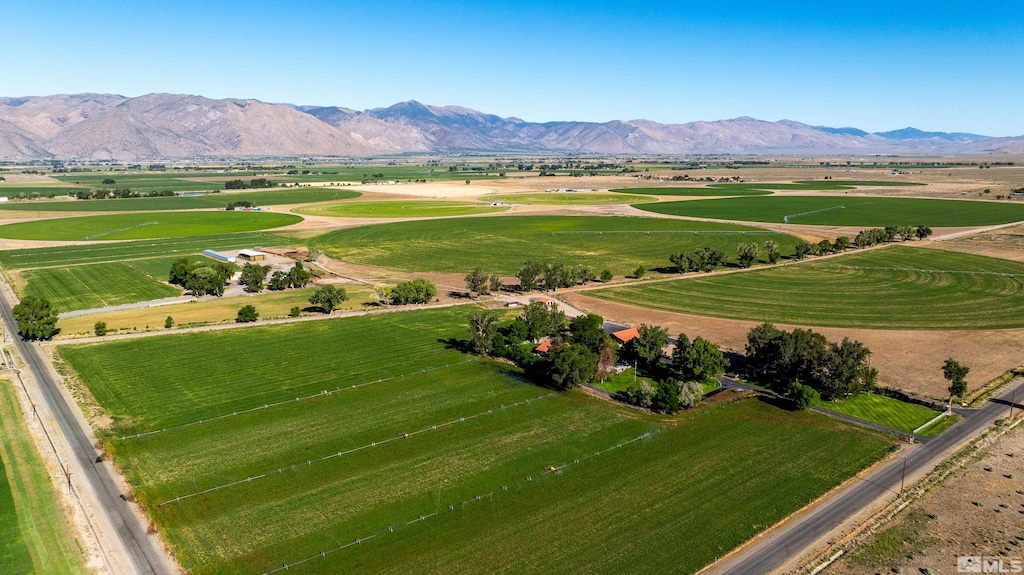 birds eye view of property featuring a mountain view and a rural view