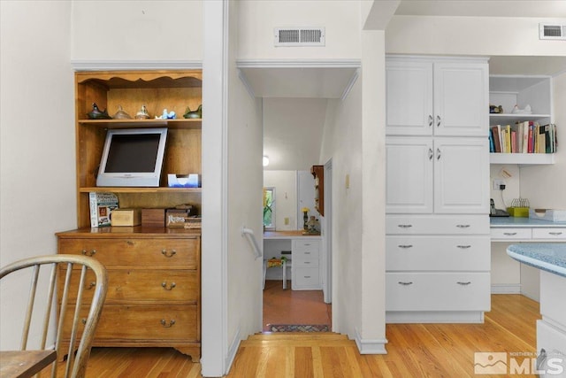 interior space featuring light hardwood / wood-style flooring and built in desk