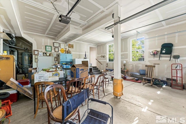 dining room featuring concrete floors and strapped water heater