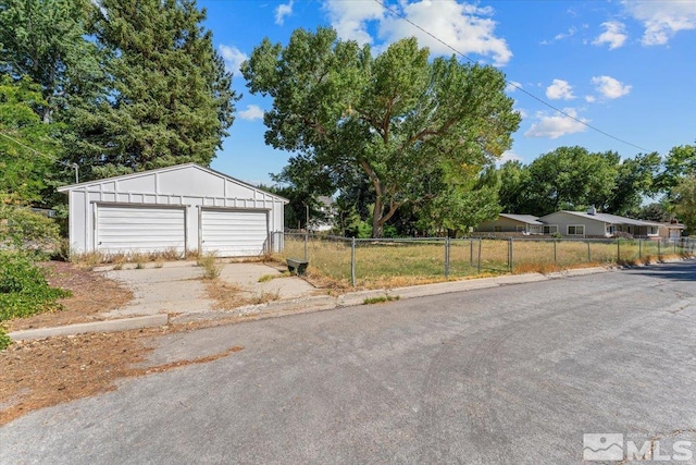 exterior space with a garage and an outdoor structure