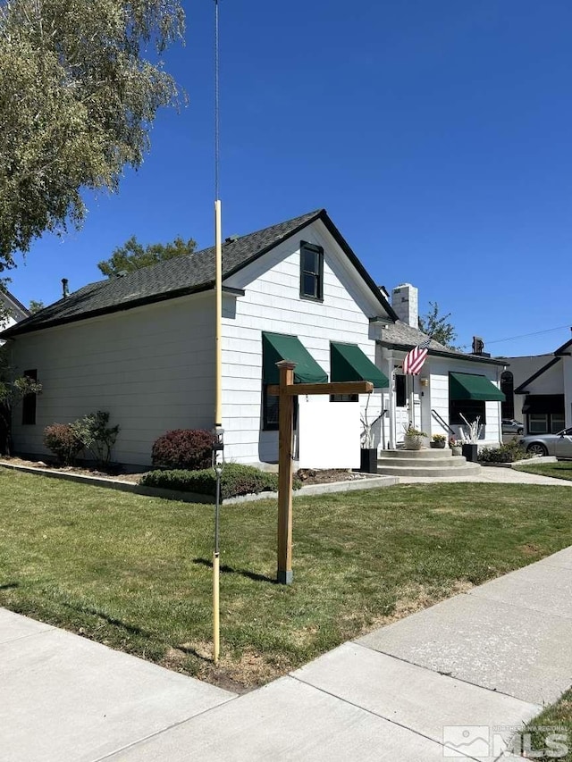 view of front of house with a front yard