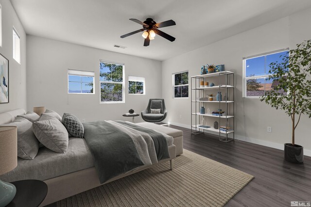 unfurnished living room with ceiling fan and dark wood-type flooring