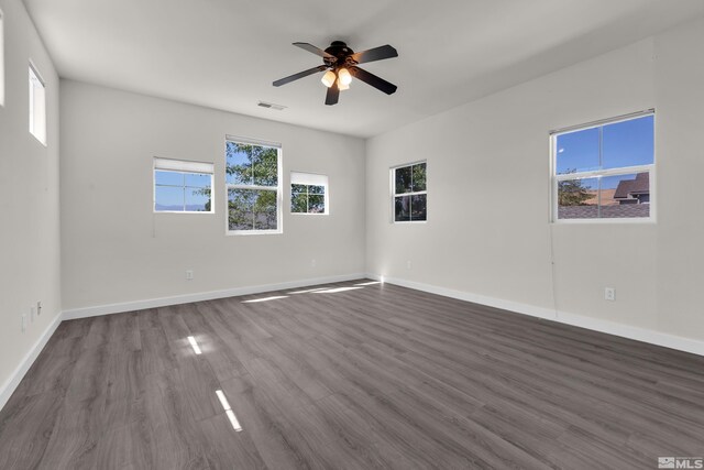 unfurnished room featuring hardwood / wood-style flooring and ceiling fan