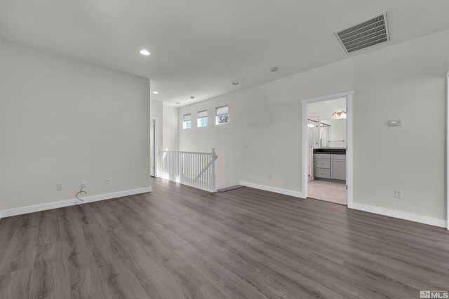 spare room featuring dark hardwood / wood-style floors