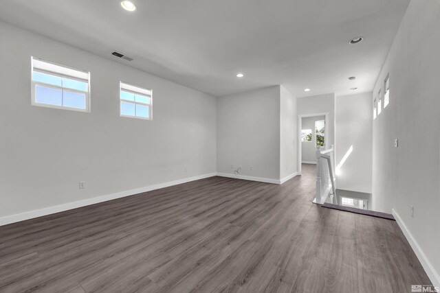 empty room featuring dark wood-type flooring