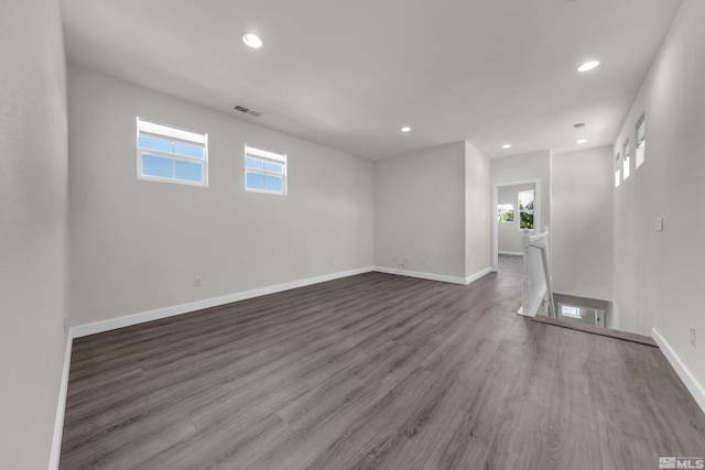 unfurnished room with wood-type flooring