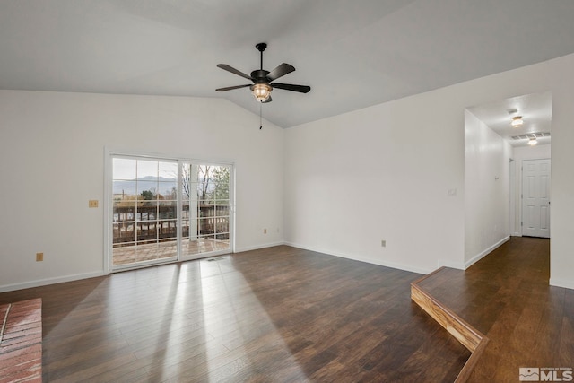 unfurnished room featuring dark wood-style floors, vaulted ceiling, baseboards, and ceiling fan