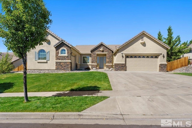 view of front facade with a garage, stone siding, fence, and a front lawn