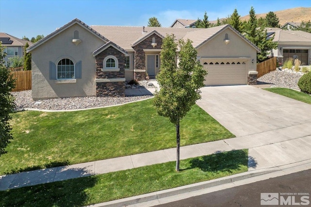 ranch-style home featuring a garage and a front lawn