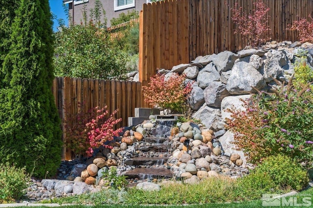 view of yard featuring fence