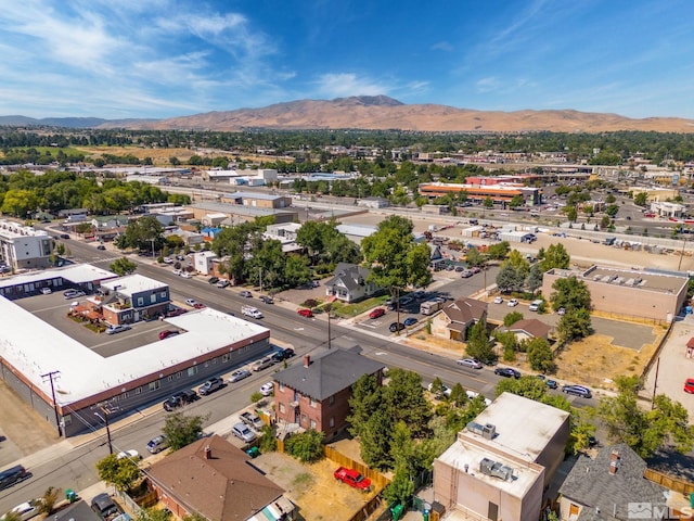 birds eye view of property with a mountain view