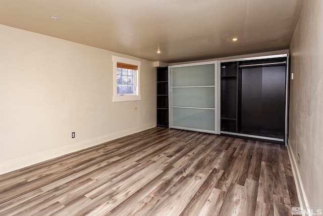 unfurnished bedroom featuring wood-type flooring