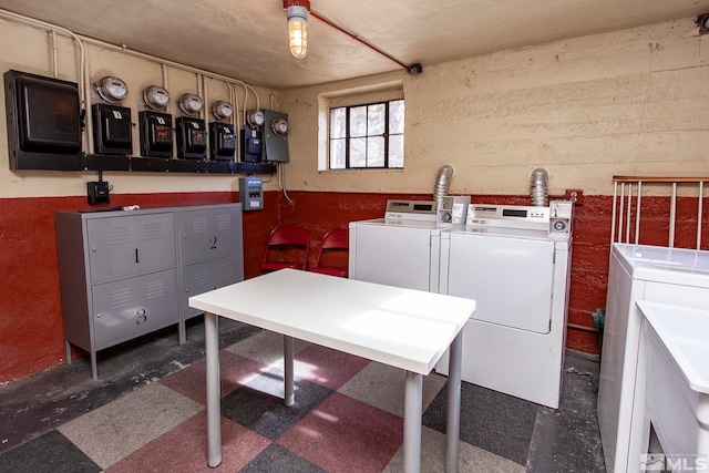 clothes washing area with washer and dryer