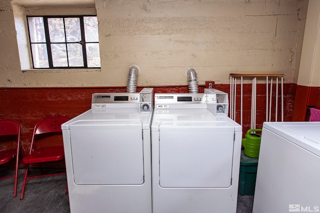 washroom featuring washing machine and dryer