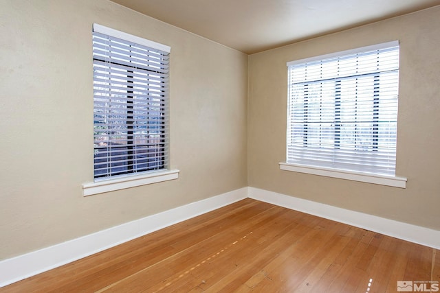 empty room featuring hardwood / wood-style flooring