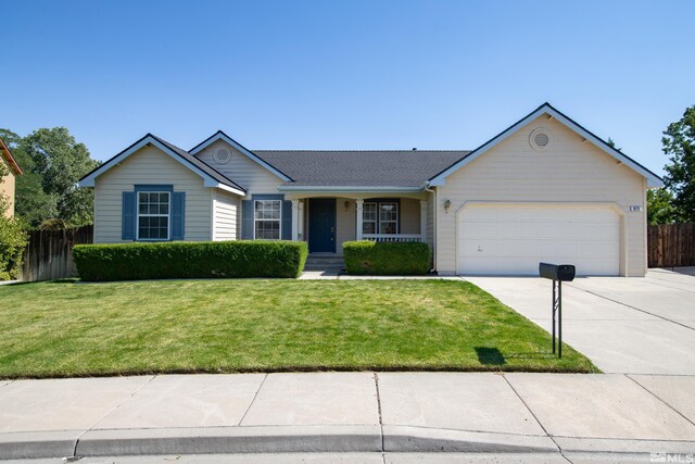 ranch-style home with a garage and a front yard