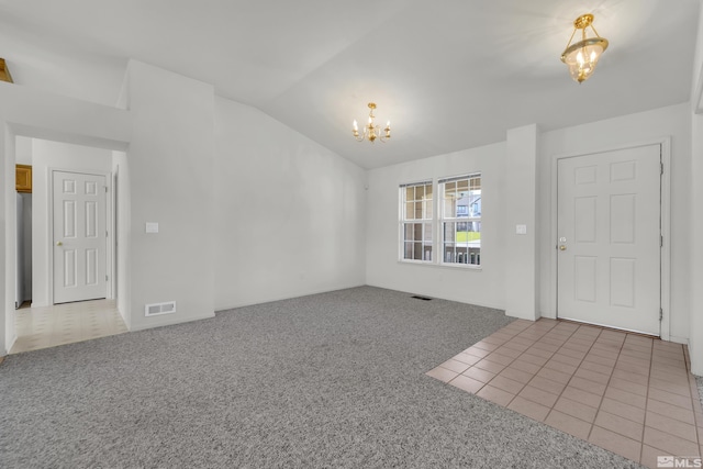 interior space featuring light carpet, light tile patterned floors, visible vents, lofted ceiling, and an inviting chandelier