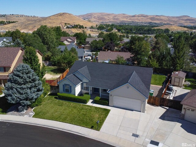 birds eye view of property with a mountain view