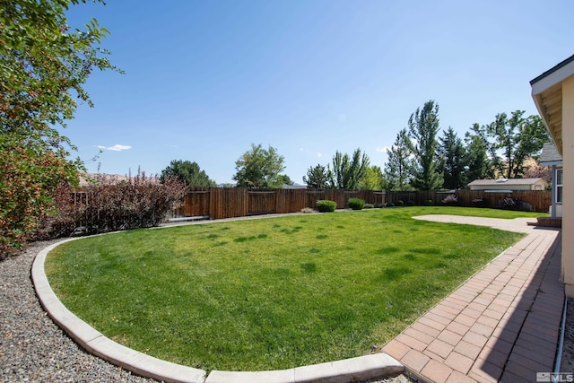 view of yard featuring a fenced backyard