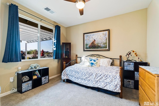 bedroom with light colored carpet and ceiling fan