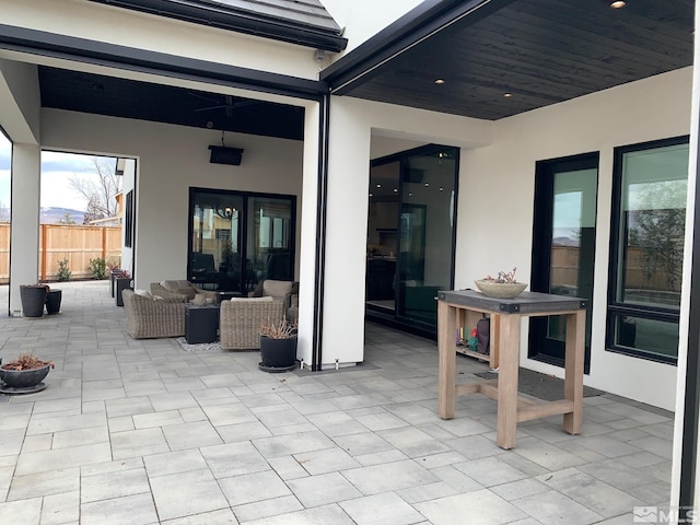 view of patio / terrace featuring fence and an outdoor living space