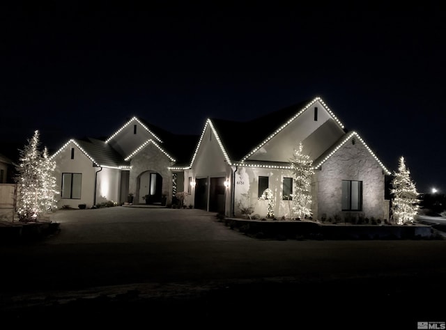 view of front facade with driveway and an attached garage