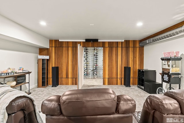 carpeted home theater with wooden walls