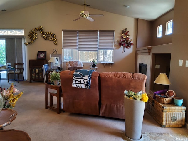 carpeted living room featuring high vaulted ceiling, ceiling fan, and plenty of natural light