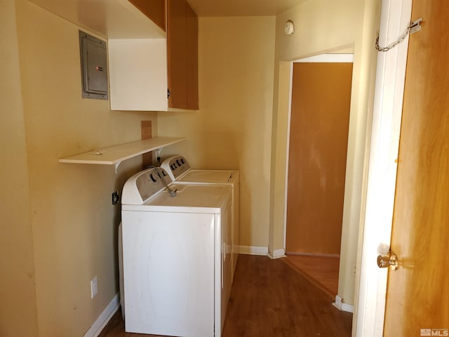 laundry room featuring electric panel, dark hardwood / wood-style floors, and separate washer and dryer