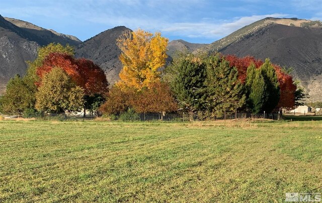 mountain view featuring a rural view