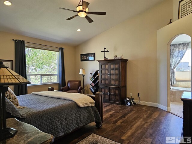 bedroom with ceiling fan, hardwood / wood-style flooring, ensuite bathroom, and vaulted ceiling