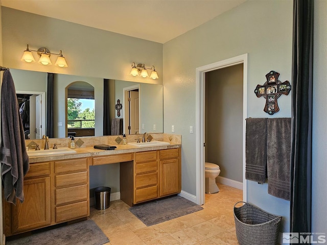 bathroom with tile patterned floors, toilet, and vanity