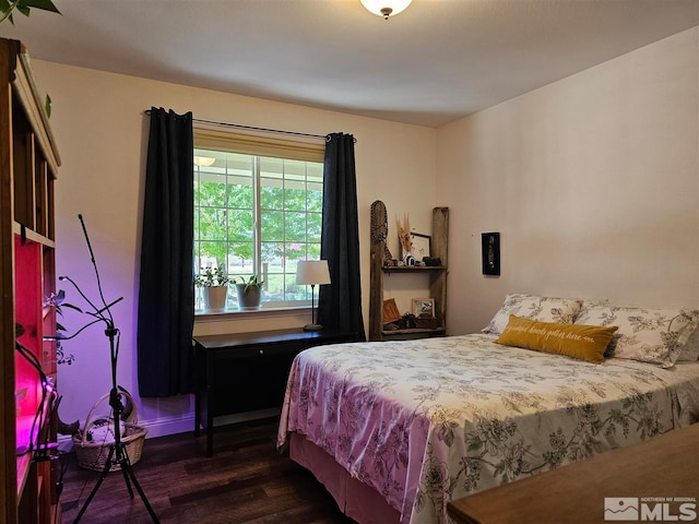 bedroom featuring dark hardwood / wood-style floors