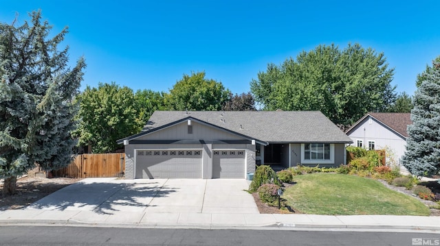 ranch-style home featuring a garage and a front yard