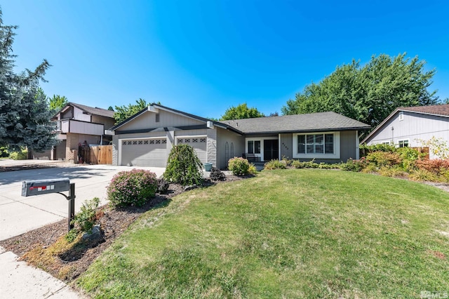 single story home with a garage and a front yard