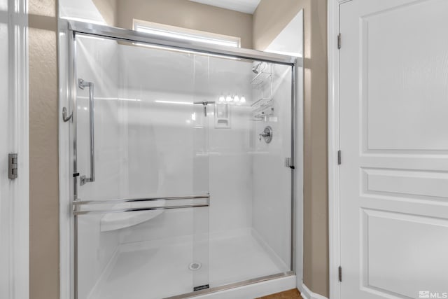 bathroom featuring an enclosed shower