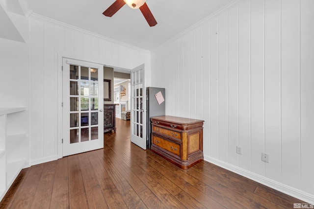 unfurnished room featuring ceiling fan, hardwood / wood-style flooring, crown molding, and french doors