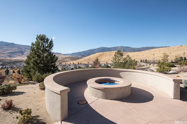 view of patio / terrace featuring a mountain view