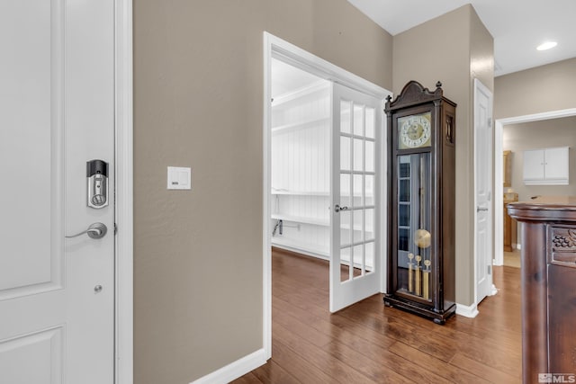 hallway featuring dark hardwood / wood-style flooring