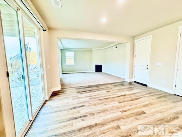 unfurnished room with light hardwood / wood-style flooring