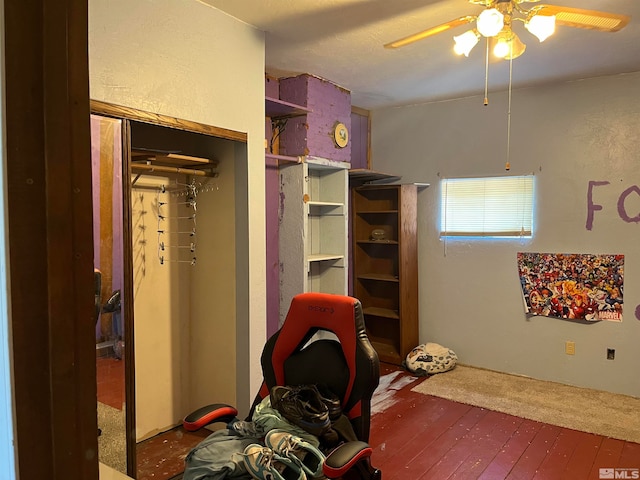 bedroom featuring ceiling fan and dark hardwood / wood-style floors