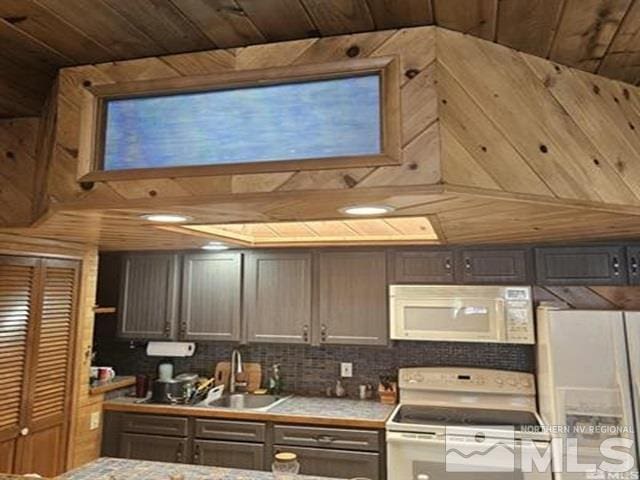 kitchen with decorative backsplash, white appliances, wooden ceiling, and a sink