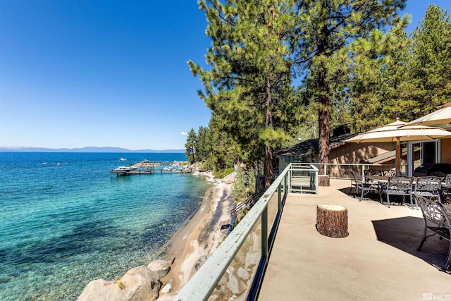 water view featuring a view of the beach and a mountain view