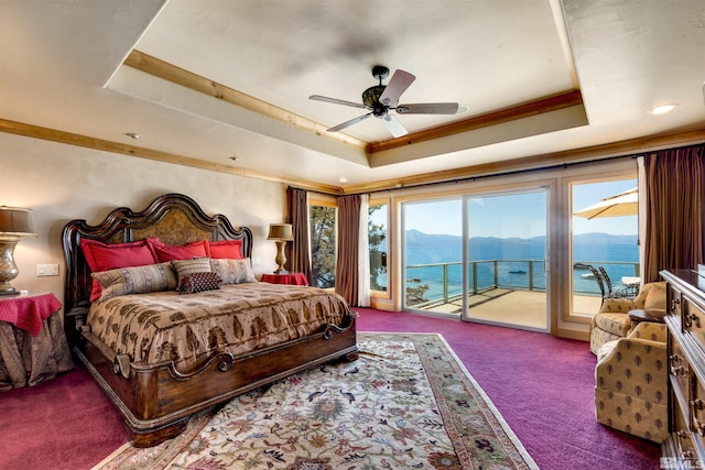 carpeted bedroom featuring a ceiling fan, access to outside, and a raised ceiling