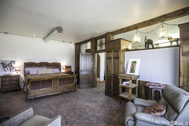 carpeted bedroom featuring beam ceiling