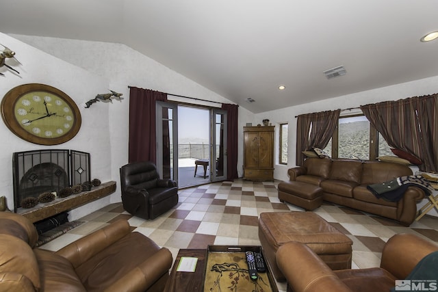 living area featuring visible vents, a large fireplace, vaulted ceiling, recessed lighting, and tile patterned floors