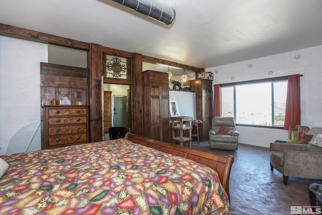 bedroom featuring concrete floors