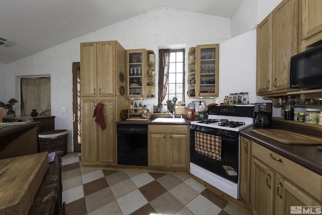 kitchen with visible vents, lofted ceiling, light floors, and black appliances