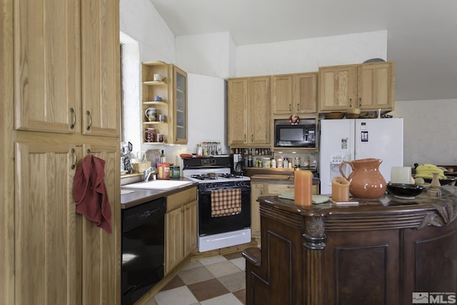 kitchen with a sink, light floors, light countertops, black appliances, and open shelves